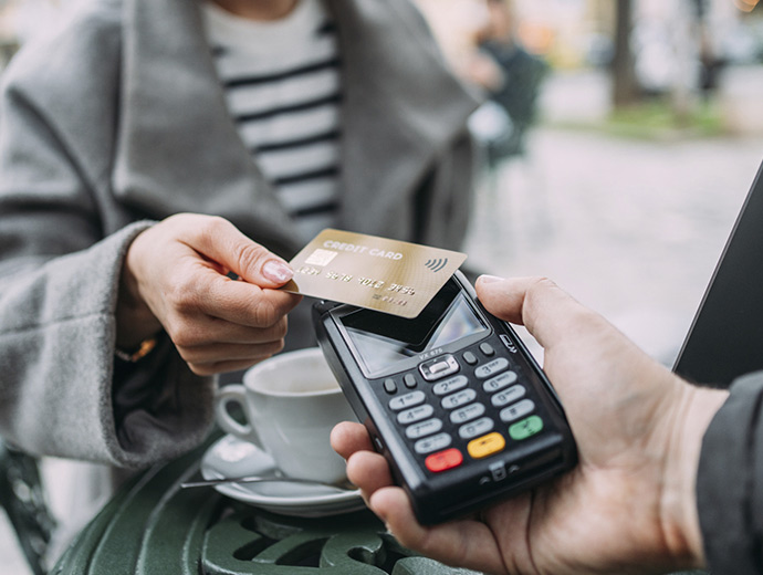 Person using their card to make a payment.