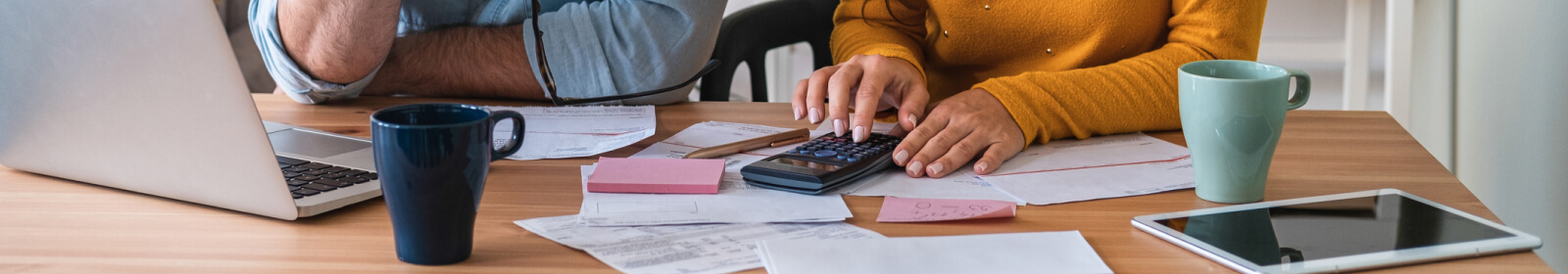 Person using calculator and financials.